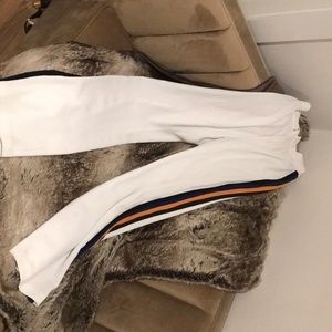 White pants w/ blue, black, yellow striped sides
